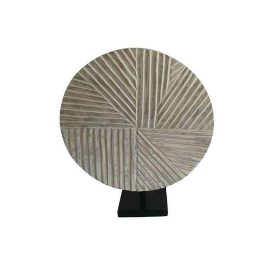 Wooden carved object with black marble base
