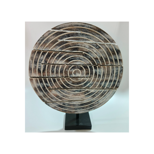 wooden carved object with black marble base