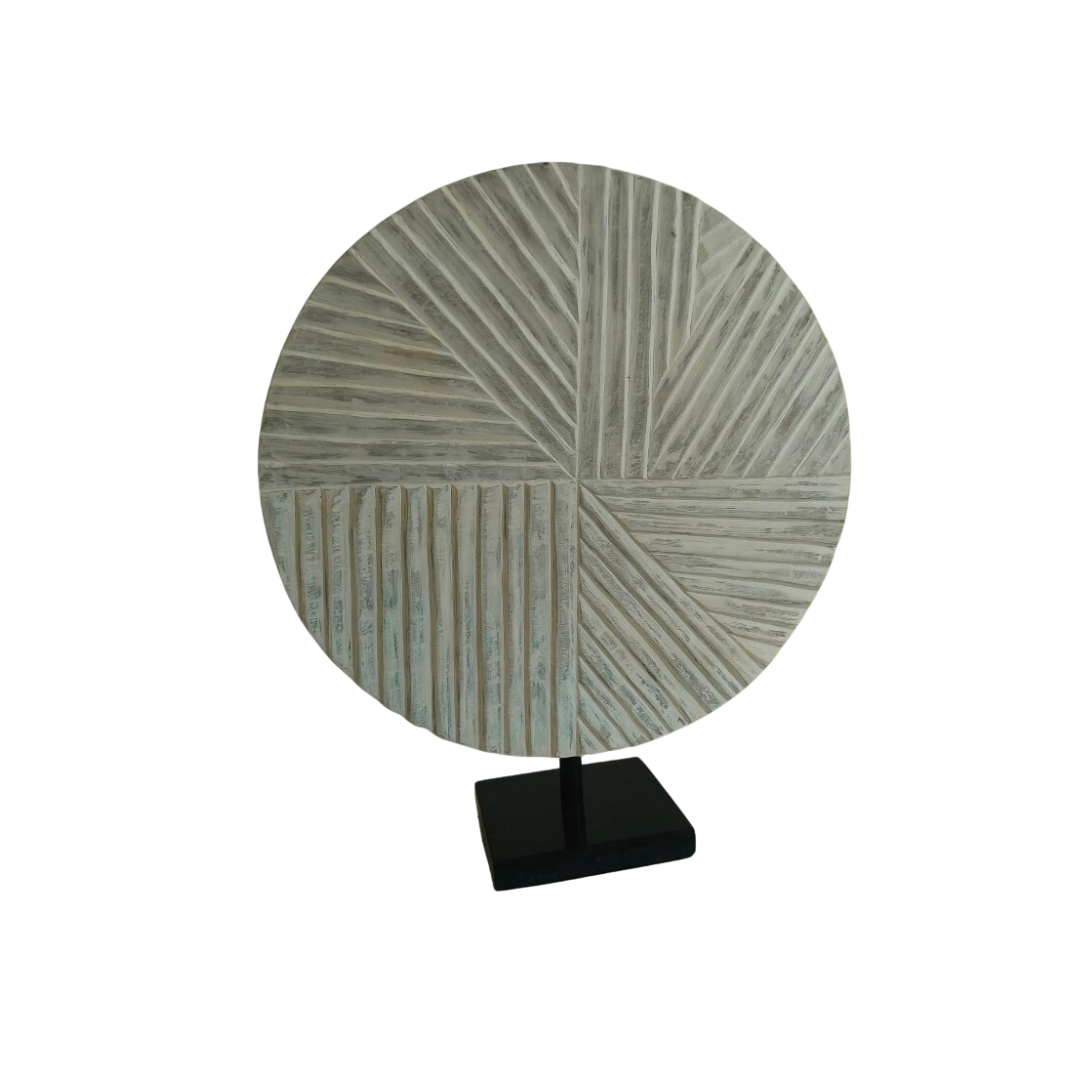 Wooden carved object with black marble base