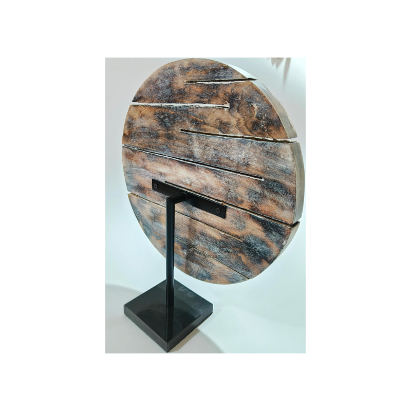 wooden carved object with black marble base